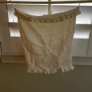 Elastic cream tube top